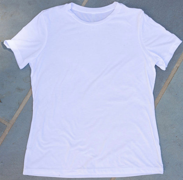 A plain short-sleeve white t-shirt on the floor 