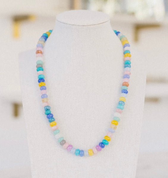 Beautiful multi-colored beaded necklace of blue, white, pink and yellow.