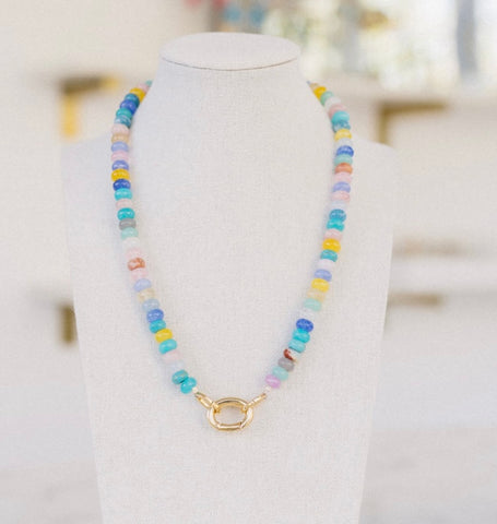 Beautiful multi-colored necklace of blue, white, yellow and pinks with a gold clasp.