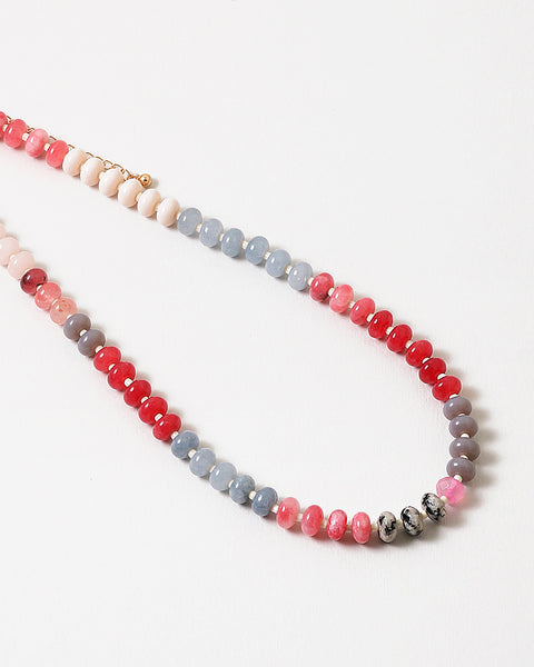 An image of a multicolored beaded short necklace (blue, gray, and red)