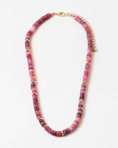 Picture of marbled rose and pink beaded necklace with gold accent beads interspersed through out.