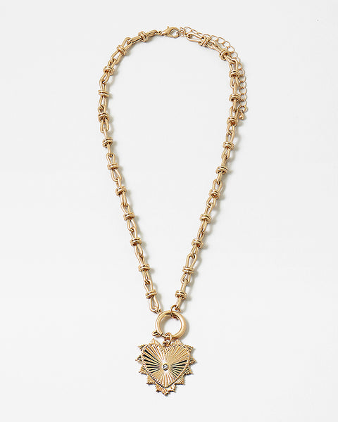 Picture of gold toggle chain with a large gold heart pendant with a diamond at its center.