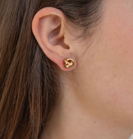 Picture of model wearing gold knot stud.