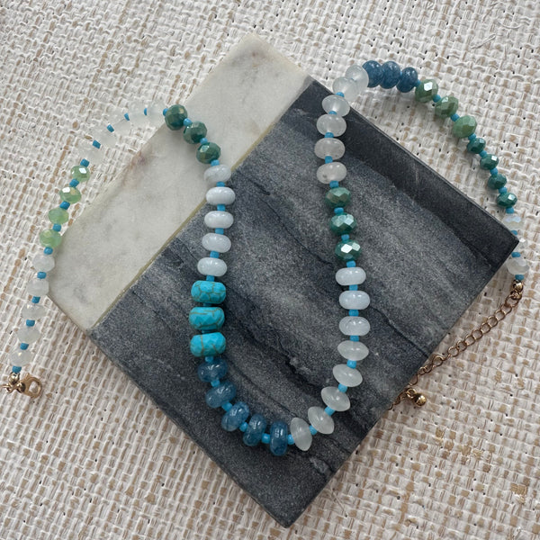 Large bead resin necklace in ombre blue, gray and white beads.