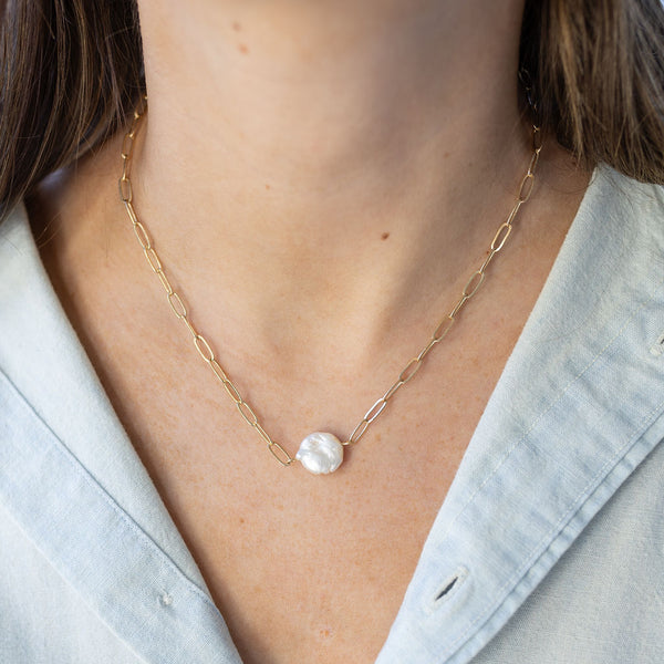 Medium sized, dainty gold chain with round mother of pearl pendant