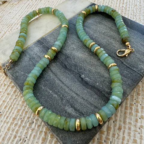 Picture of muted green beaded necklace interspersed with gold beads