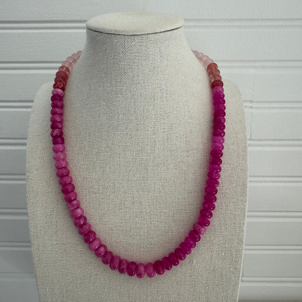 Dark pink beaded necklace.