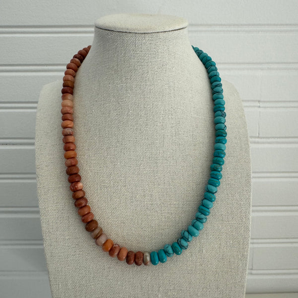 Necklace of clay colored beads and turquoise beads.