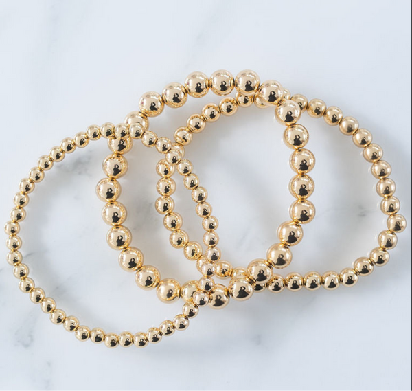 Set of three gold bead bracelets. 