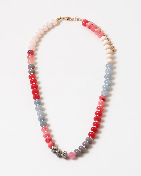 An image of a multicolored beaded short necklace (blue, gray, and red)