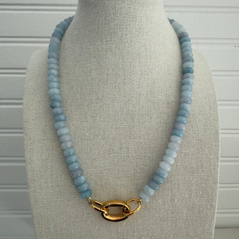 Light blue beaded semi-precious stone necklace with large gold clasp.