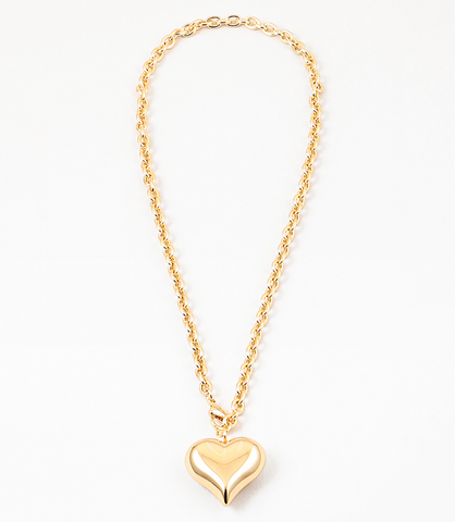 Twisted gold chain with large gold bubble heart pendant.