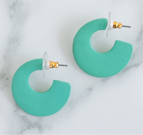 Picture of chunky mint green resin hoop earrings.