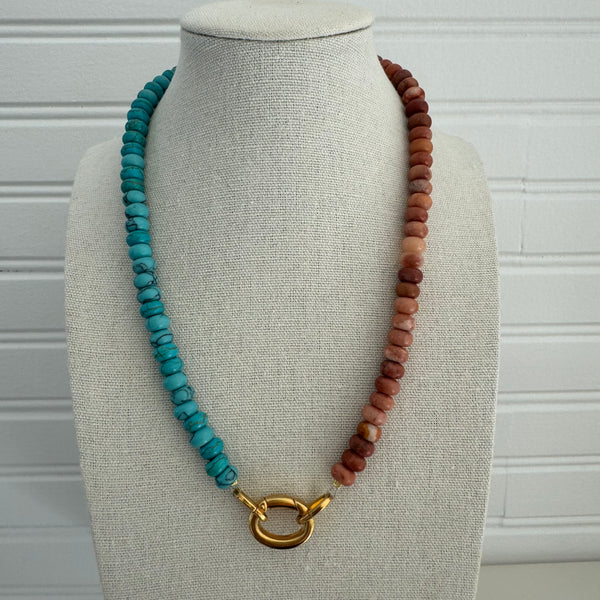 Necklace of turquoise and clay colored beads with a gold clasp.