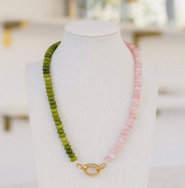 Olive green and rose colored beaded necklace with a gold clasp.