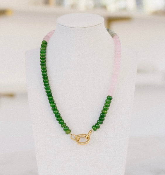 Green and pink colored beaded necklace with a gold clasp.