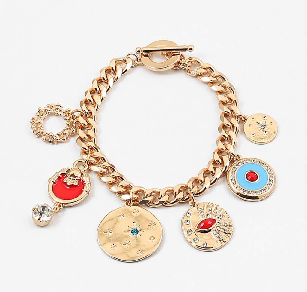 Gold charm bracelet with various gold/red/blue charms attached