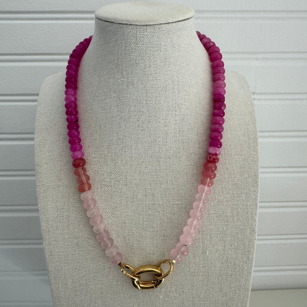 Dark pink and light pink colored beads with a gold clasp.