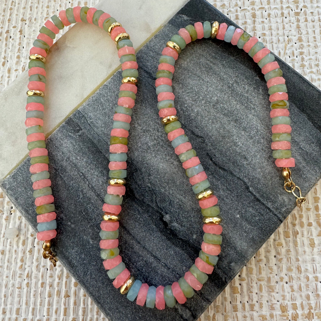 Picture of beaded necklace in rose, green, blue and gold beads.